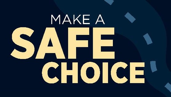 Safe Choice program’s logo reads “Make a safe choice,” in yellow font on a dark background. A road with a dotted line also appears in the background of the graphic
